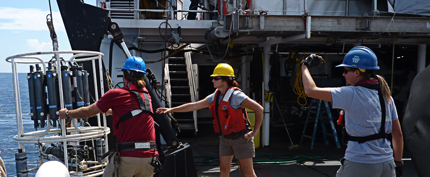 NCCOS scientists on the NOAA Ship Nancy Foster retrieve a water-column profiler and Niskin bottle water sampling rosette